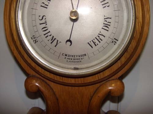 fig 1. solid oak barometer
